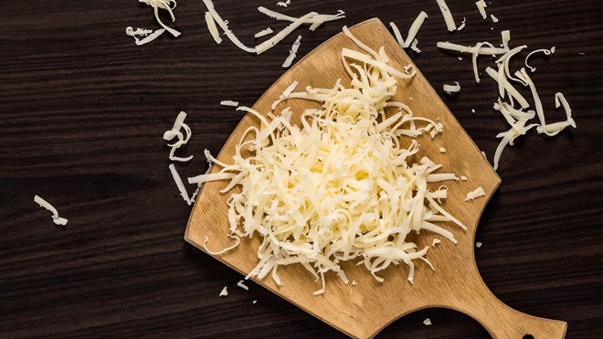 shredded-cheese-on-wooden-board